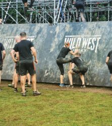 bs fixing team climbing wall at tough mudder 2022